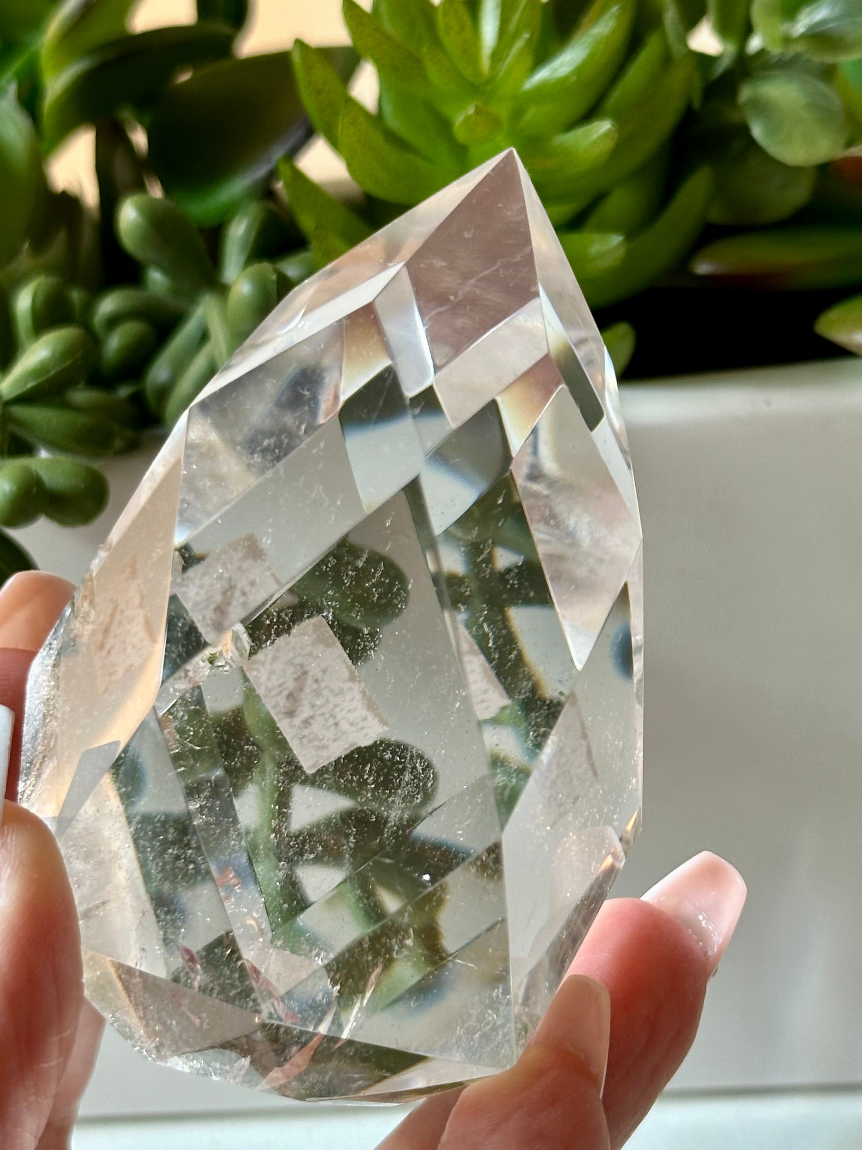 Clear quartz crystal multifaceted polished flame