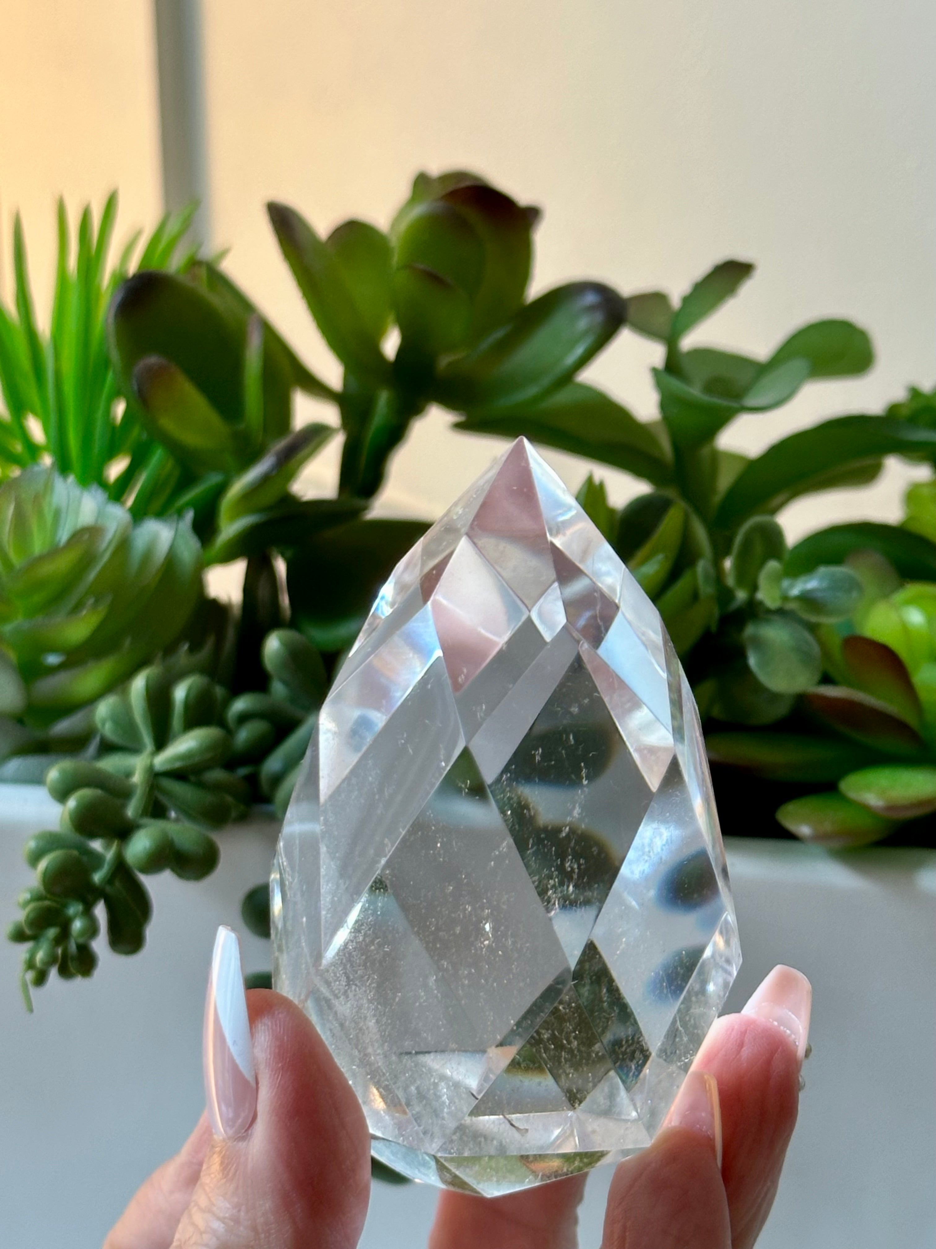 Clear quartz crystal multifaceted polished flame