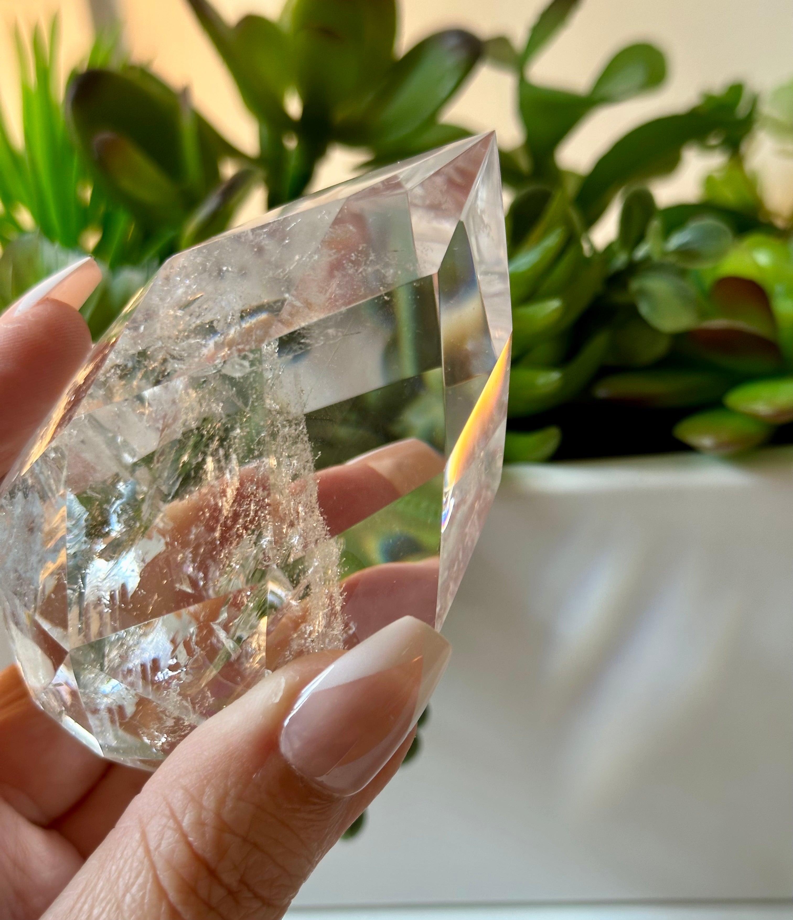 clear quartz crystal with iridescent rainbows