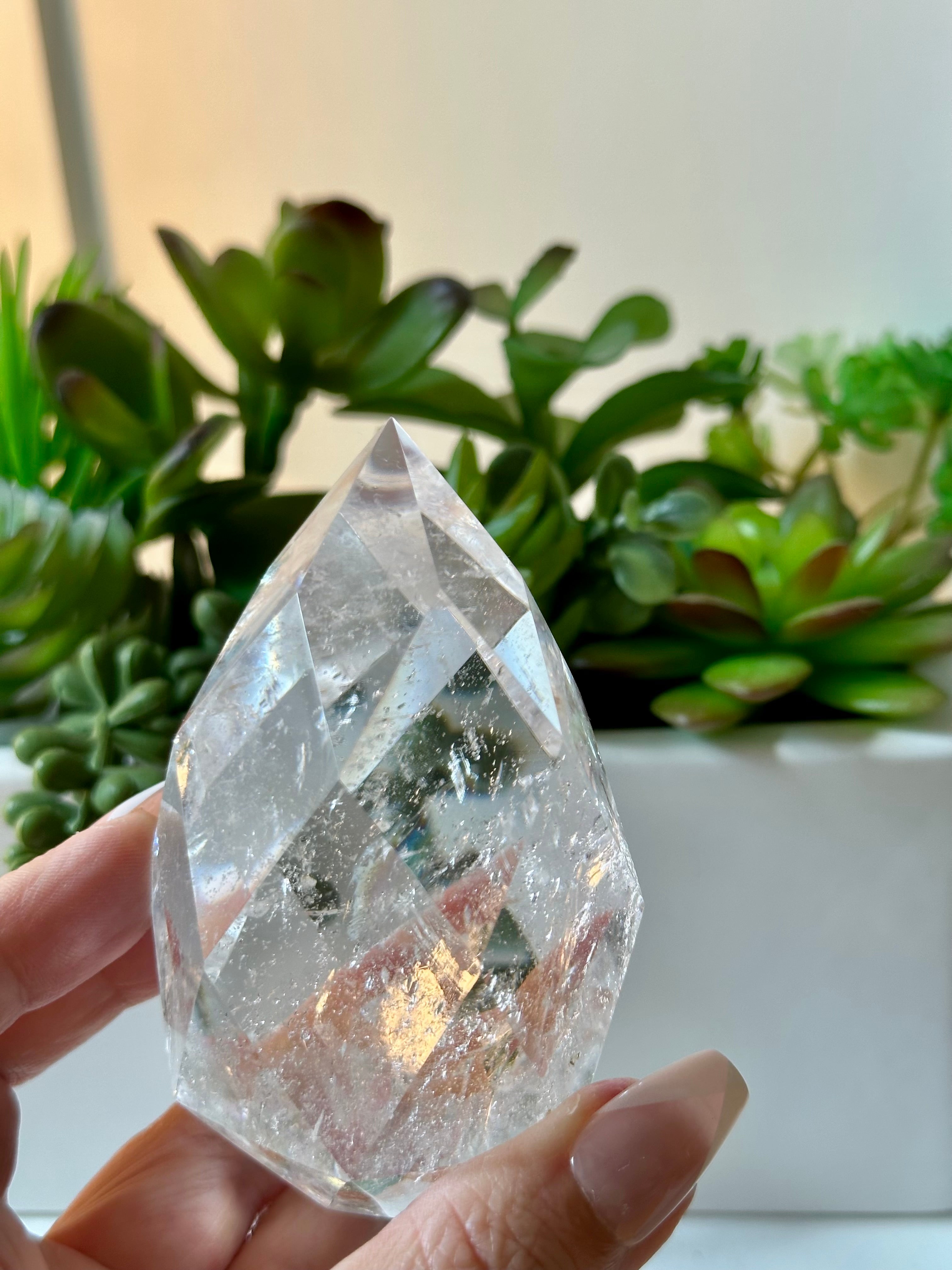 clear quartz crystal with iridescent rainbows