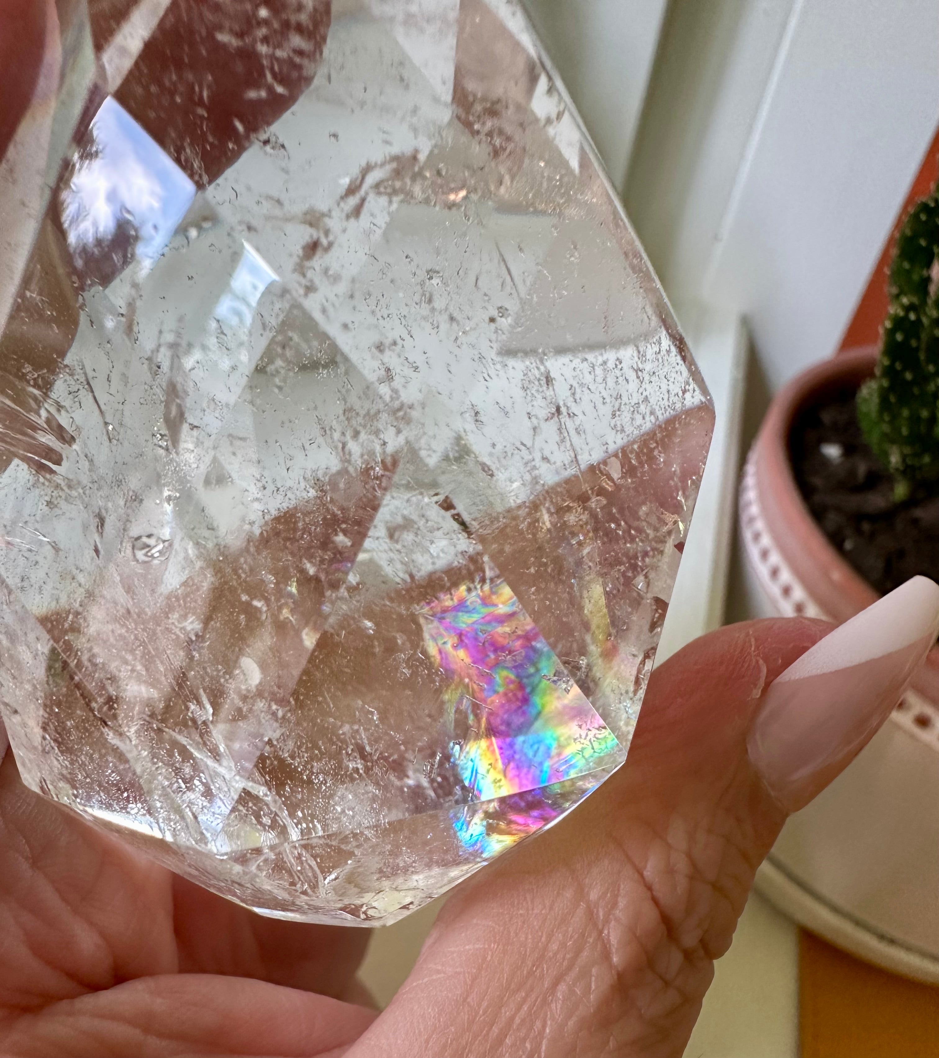 clear quartz crystal with iridescent rainbows
