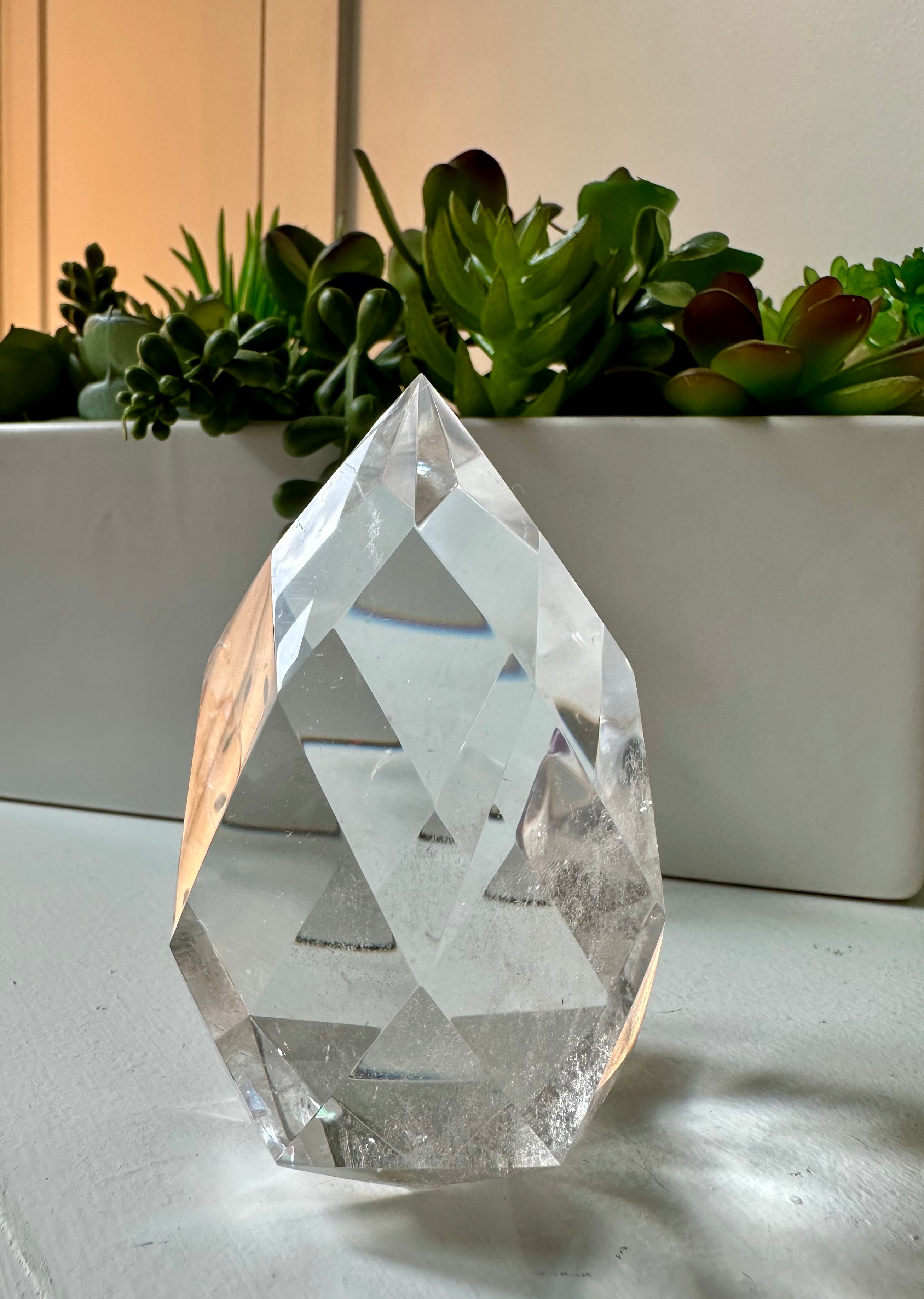 Clear quartz crystal multifaceted polished flame