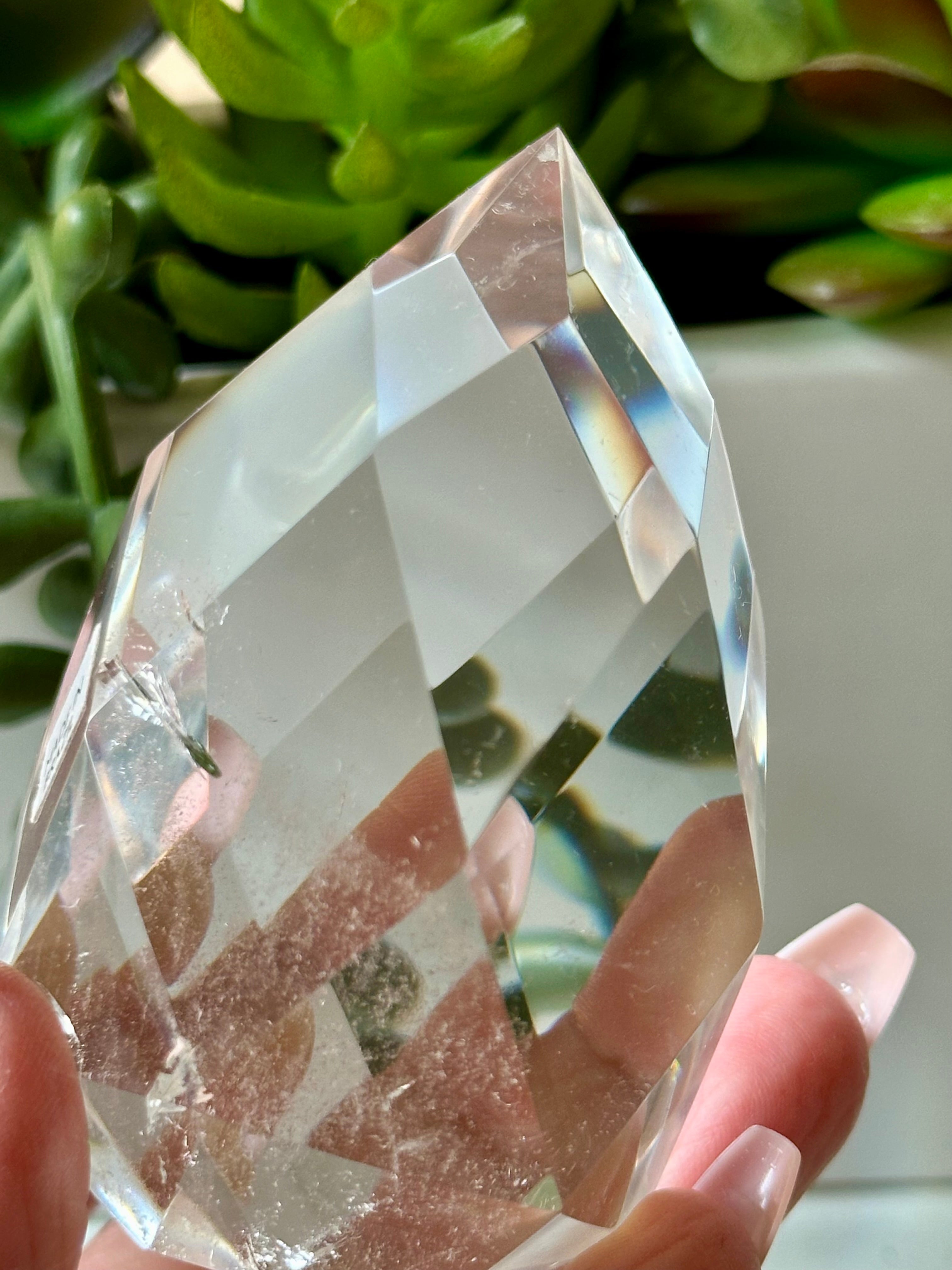 Clear quartz crystal multifaceted polished flame