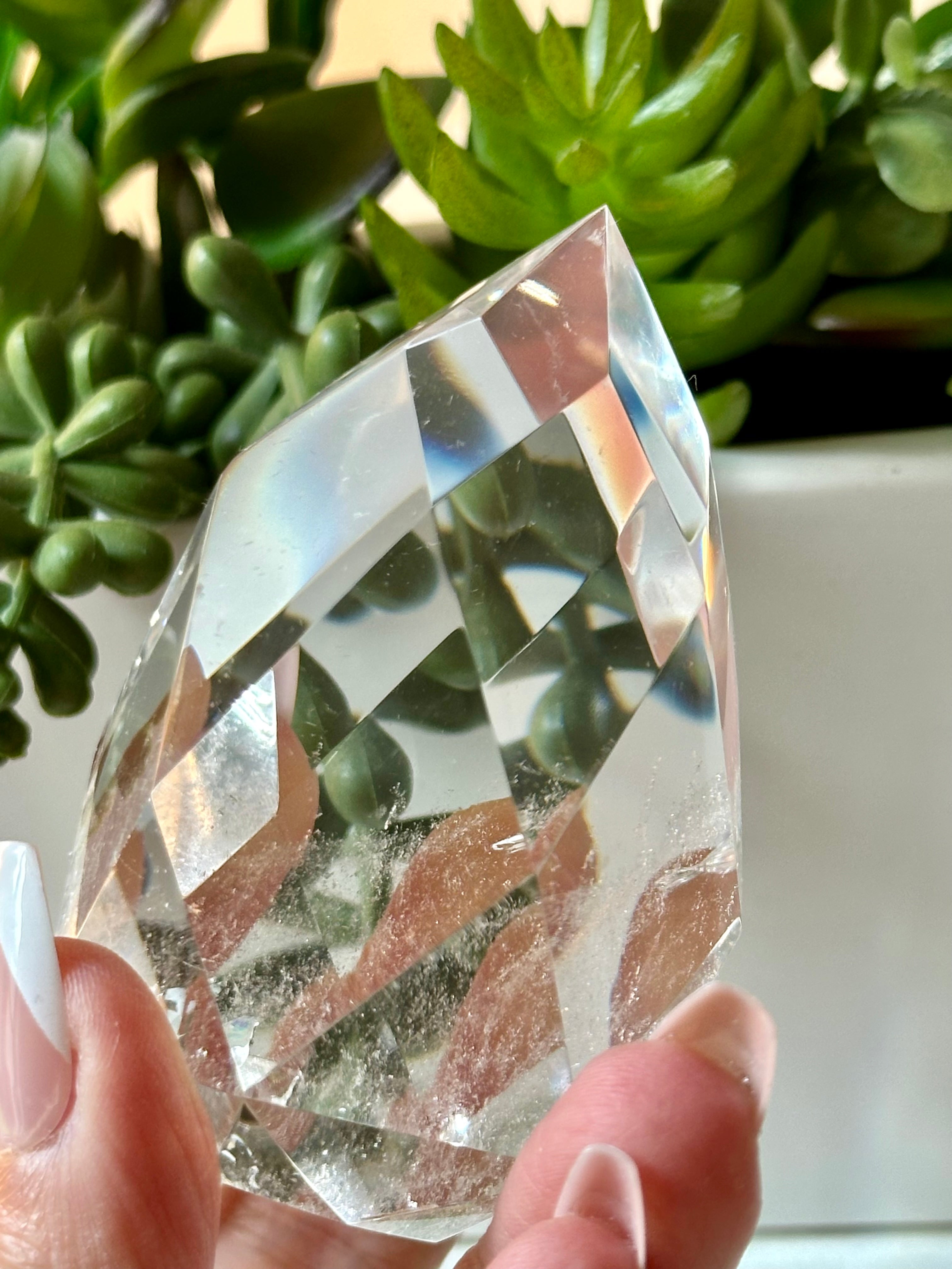Clear quartz crystal multifaceted polished flame