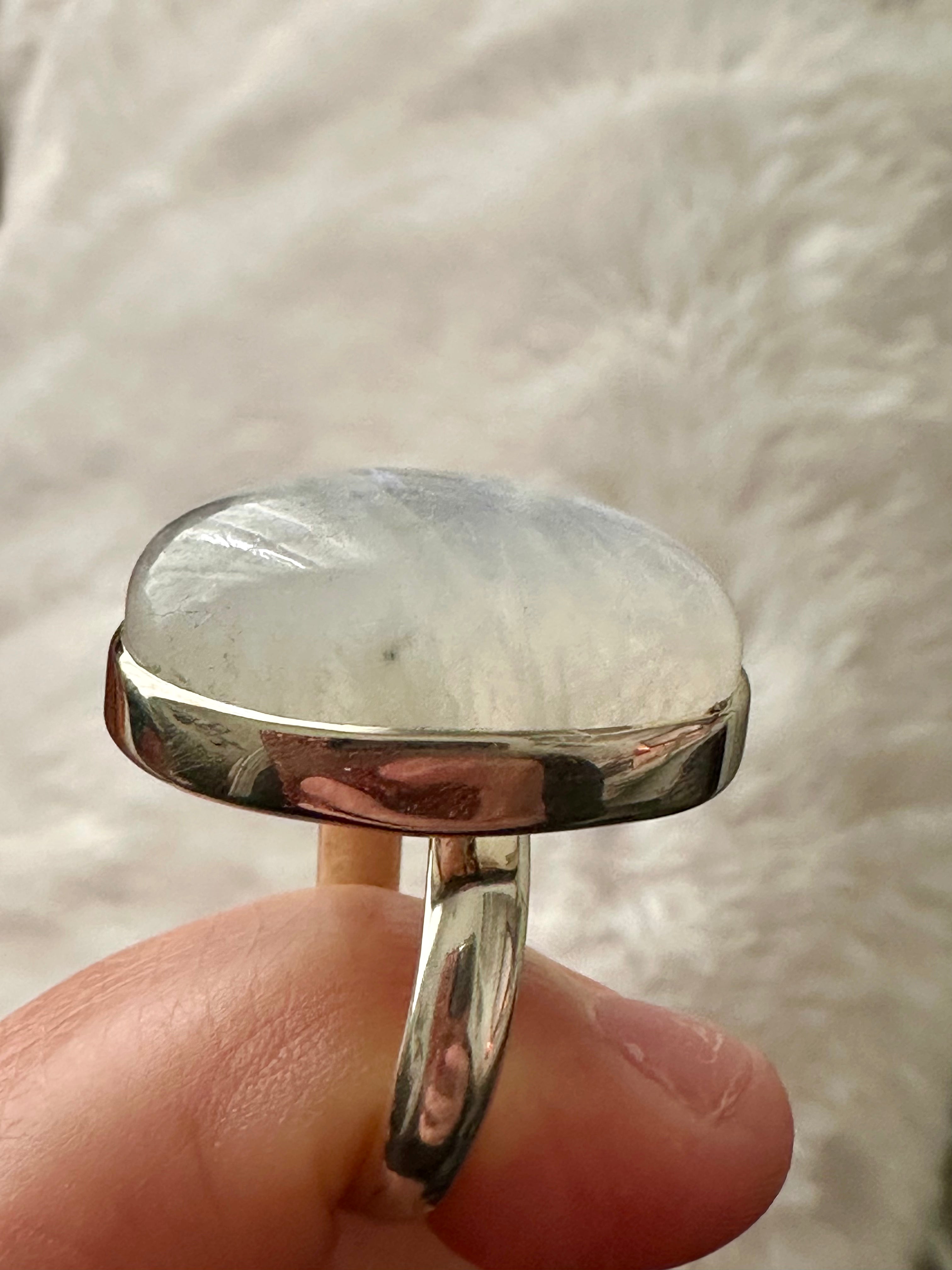 Moonstone Adjustable Silver Ring in Oval-mounded shape.