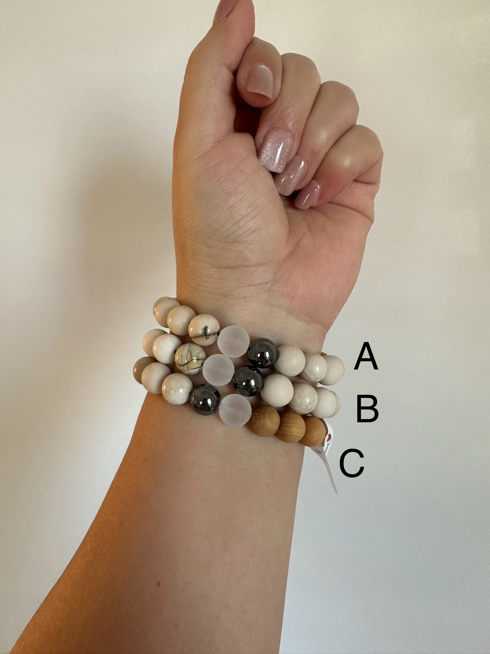 Ivory Jasper bracelets with dendritic accent, hematite, matte quartz and cypress wood beads.