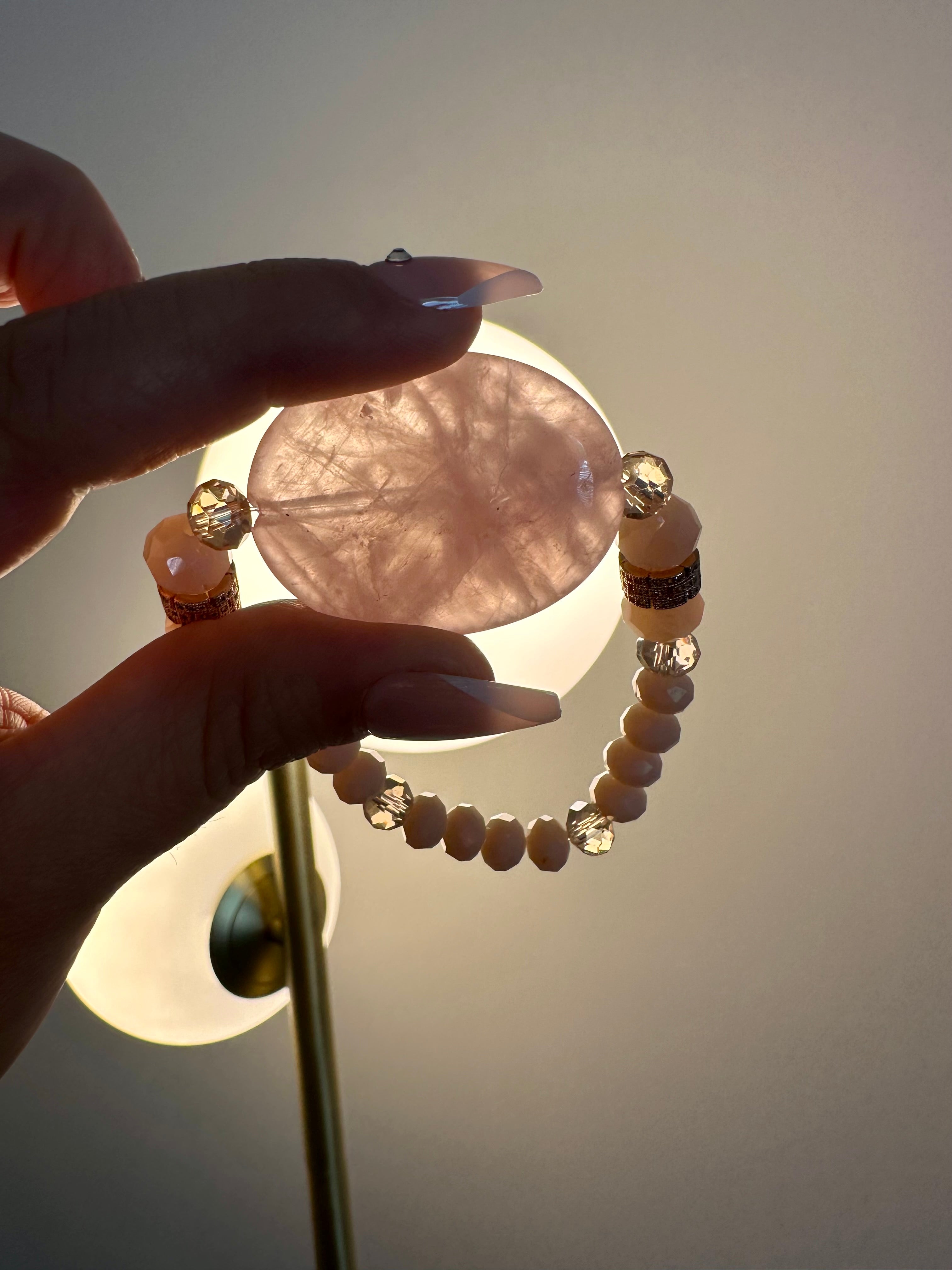 Rose quartz femine energy themed bracelet with large oblong Rose quartz gemstone.