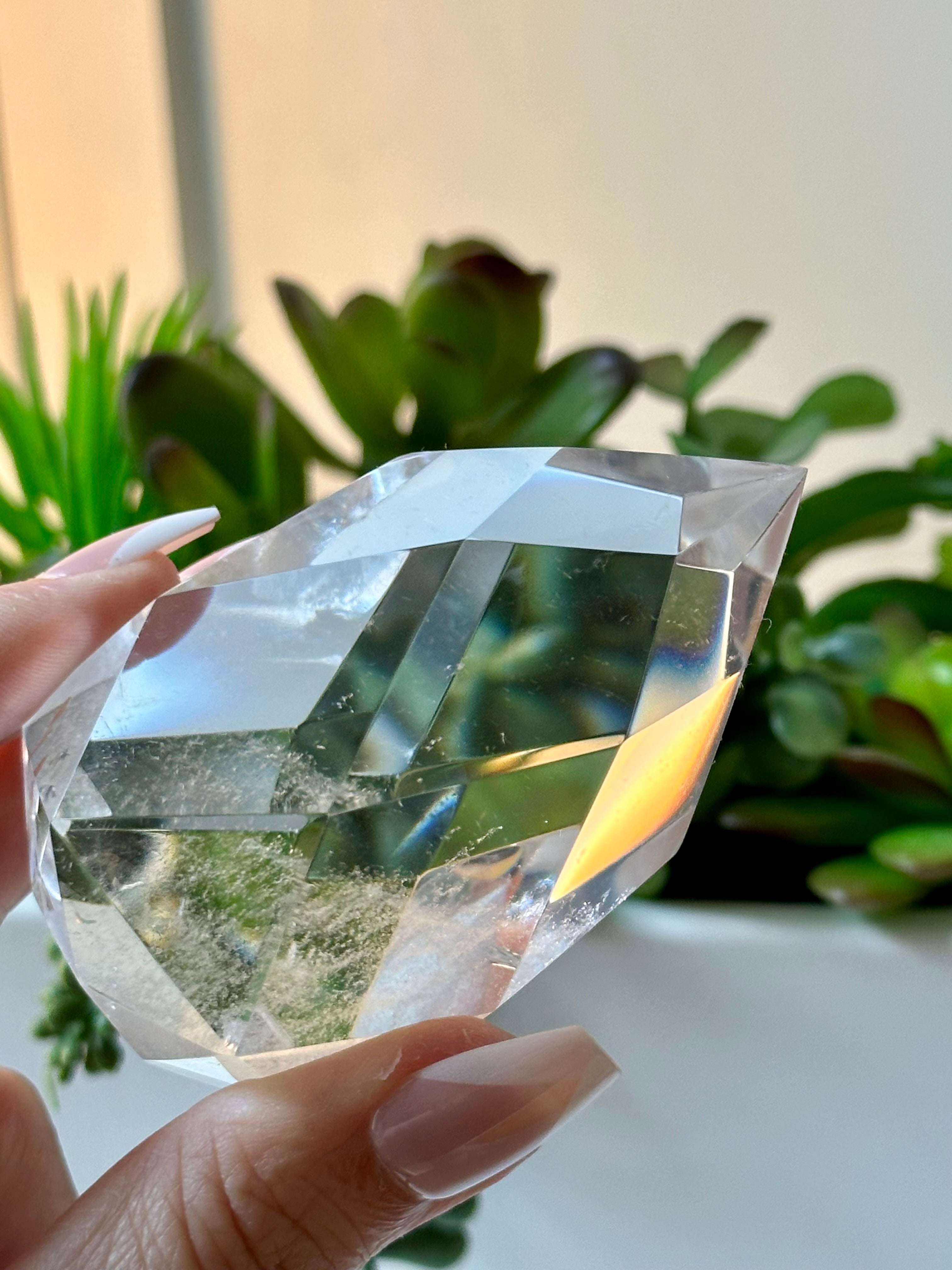 Clear quartz crystal multifaceted polished flame