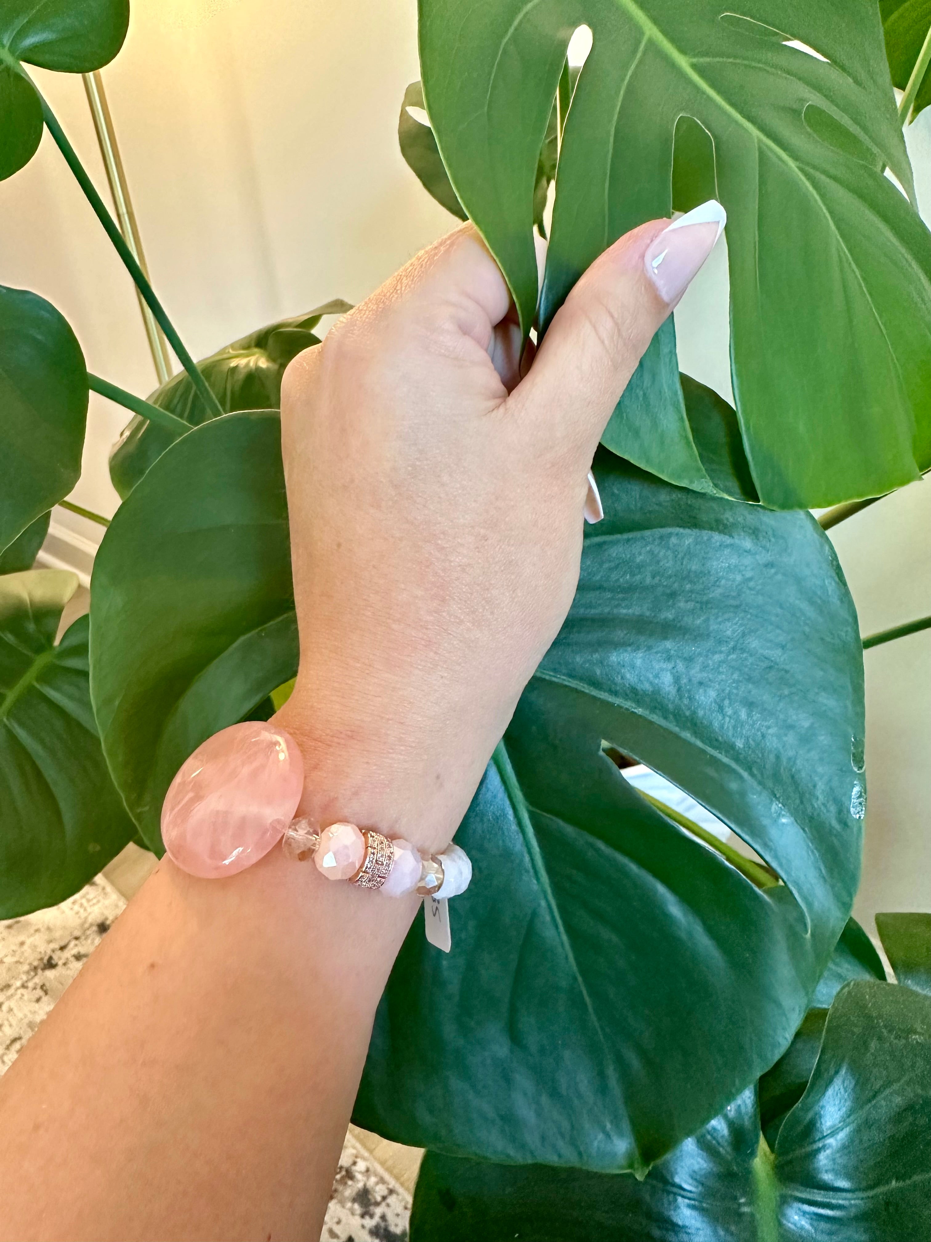 Rose quartz femine energy themed bracelet with large oblong Rose quartz gemstone.