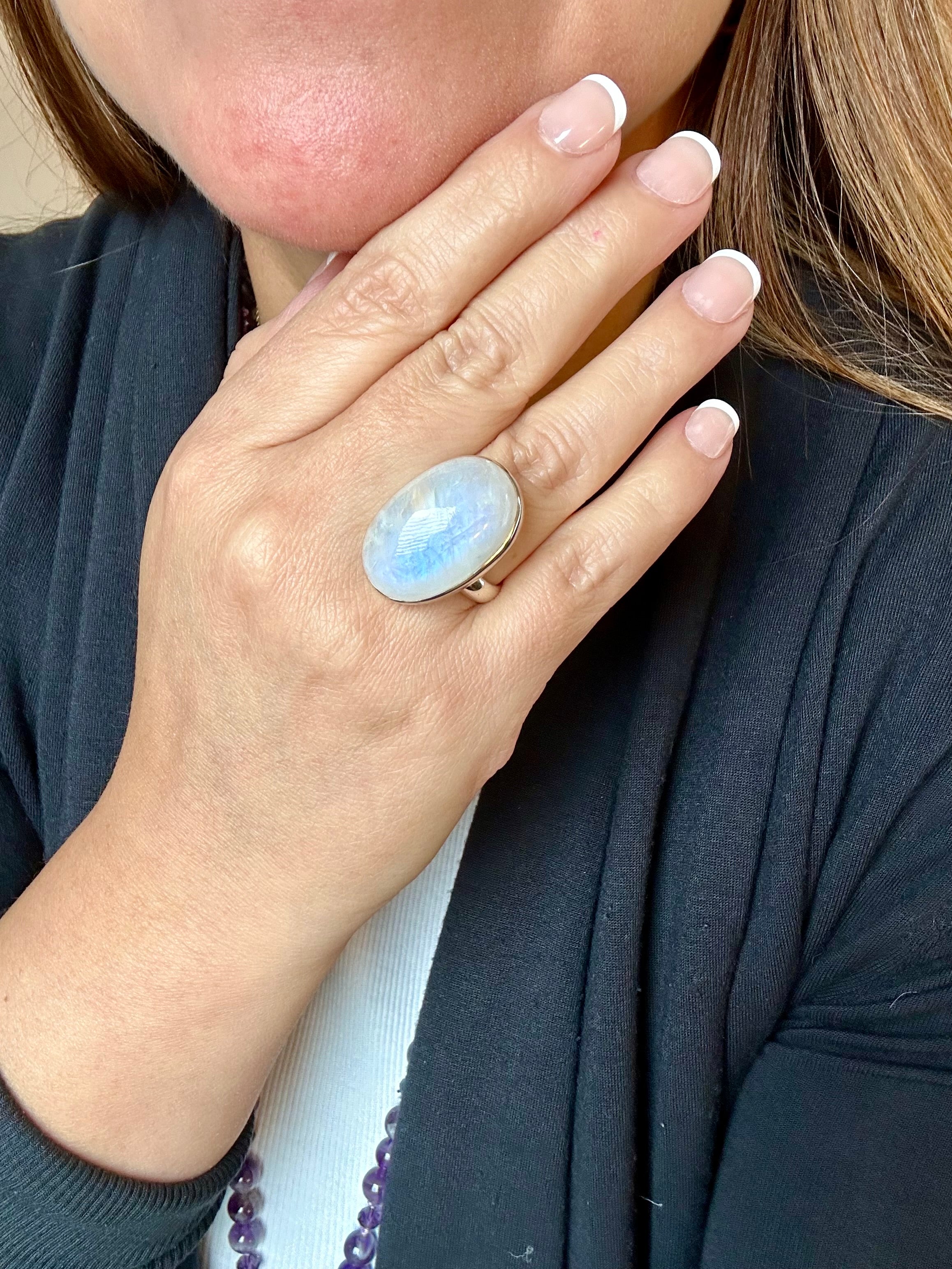 Moonstone Adjustable Silver Ring in Oval-mounded shape.