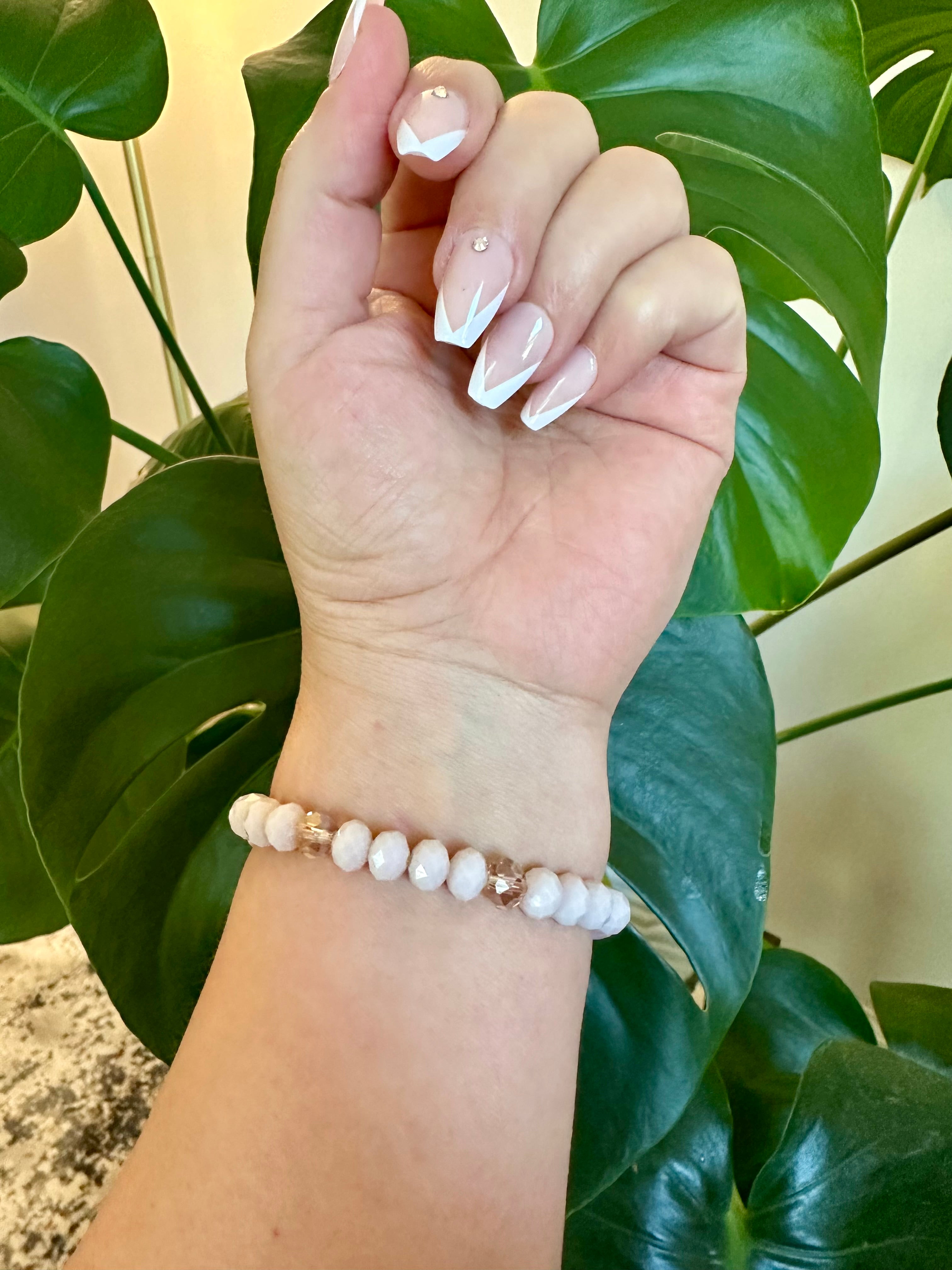 Rose quartz femine energy themed bracelet with large oblong Rose quartz gemstone.