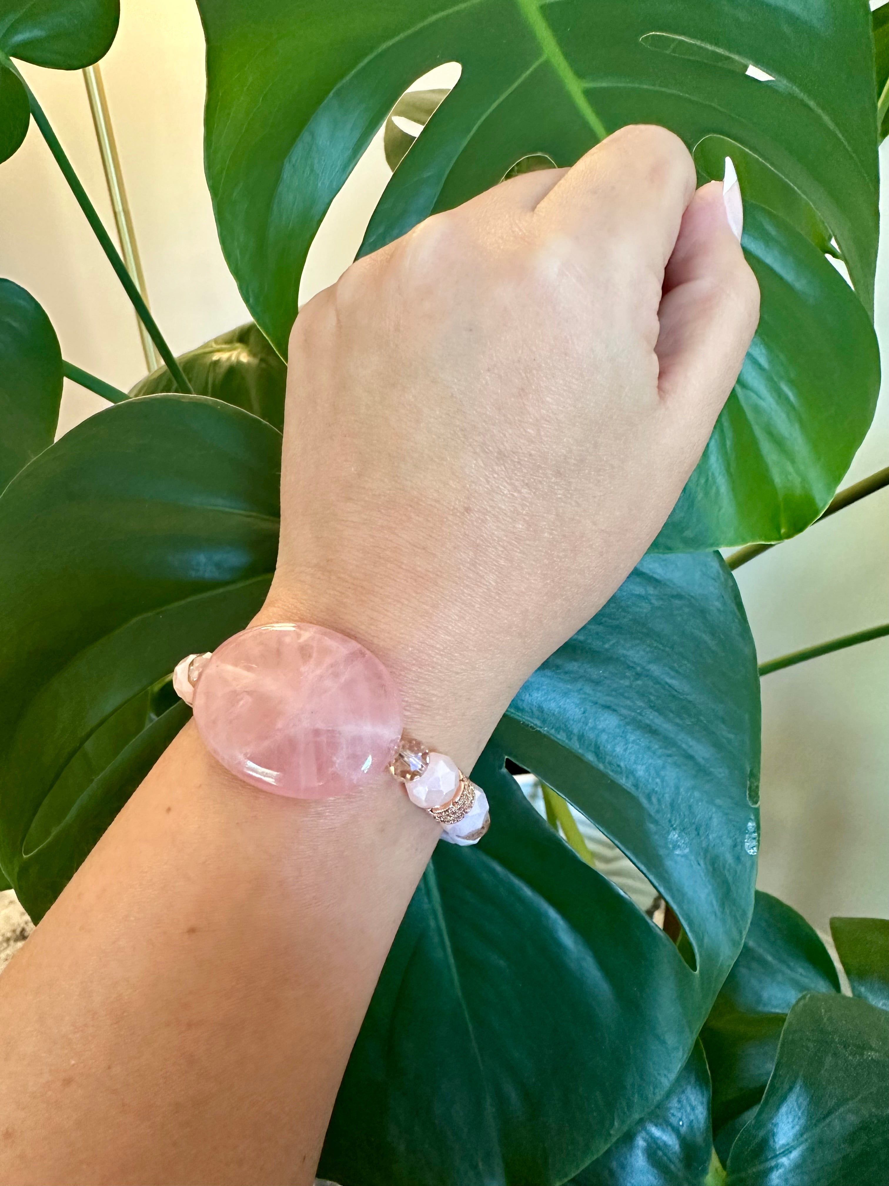 Rose quartz femine energy themed bracelet with large oblong Rose quartz gemstone.