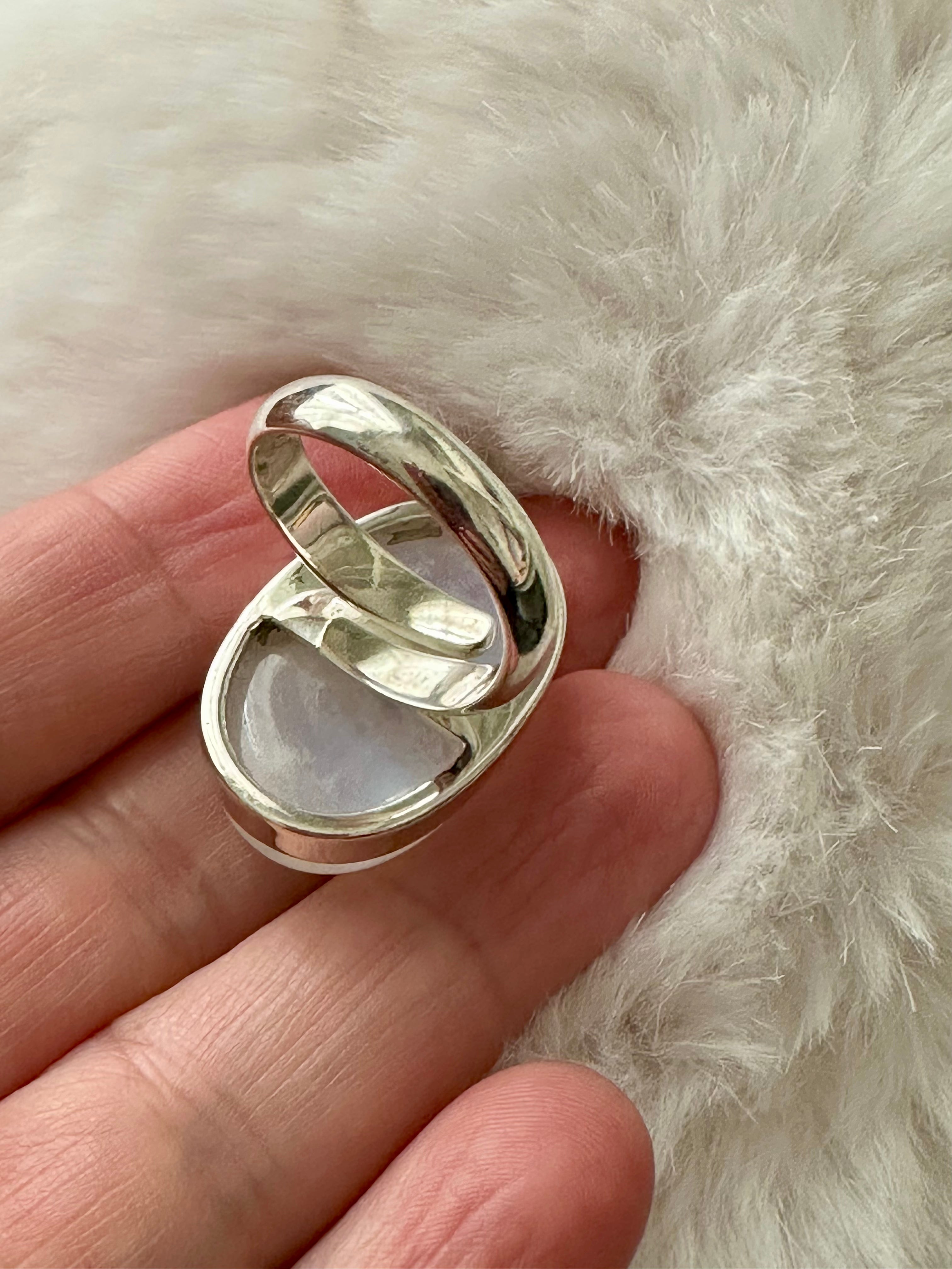 Moonstone Adjustable Silver Ring in Oval-mounded shape.