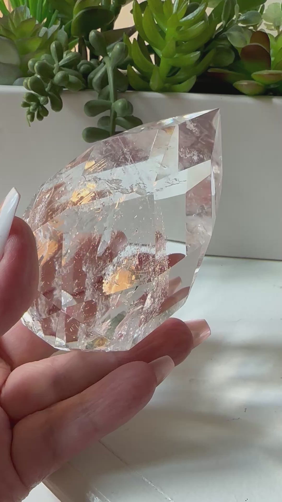 clear quartz crystal with iridescent rainbows