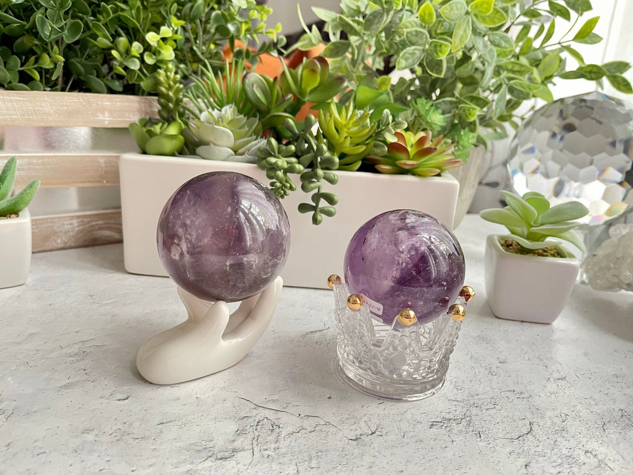 Amethyst Spheres with rare features and rainbows from Brazil. Polished Amethyst spheres perfect as crystal lamps