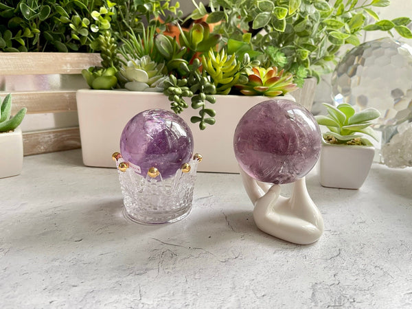 Amethyst Spheres with rare features and rainbows from Brazil. Polished Amethyst spheres perfect as crystal lamps